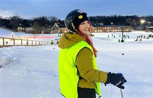 student on skis smiling